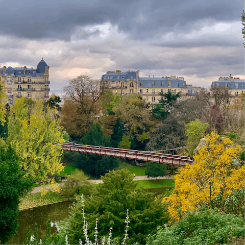 Take an afternoon stroll through the Parc des Buttes-Chaumont, a seven-minute walk away