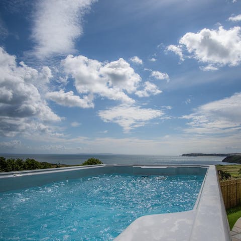 Gaze out over the ocean from the bubbling hot tub