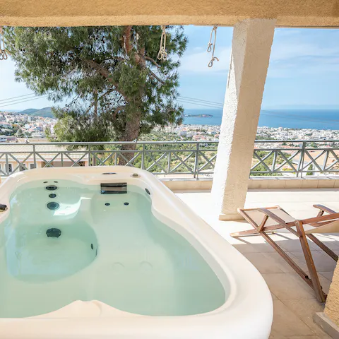 Soak in the balcony hot tub while you admire the landscape around you