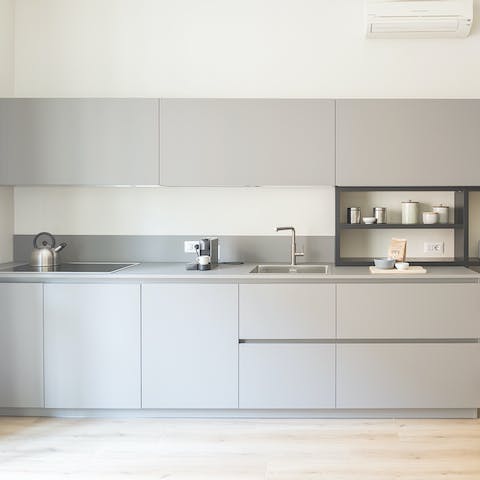 Find everything you need behind the sleek, modern cabinets of the big kitchen