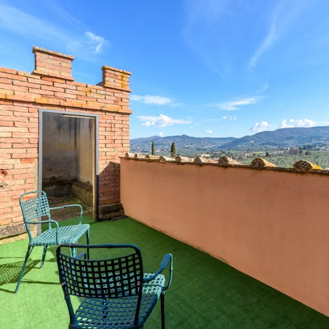 Admire the panoramas of the Tuscan countryside from the terrace