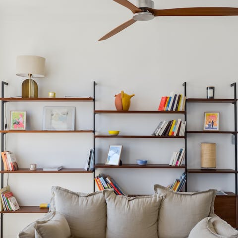 Pick a good novel from the bookshelf and relax with your feet up in the living area