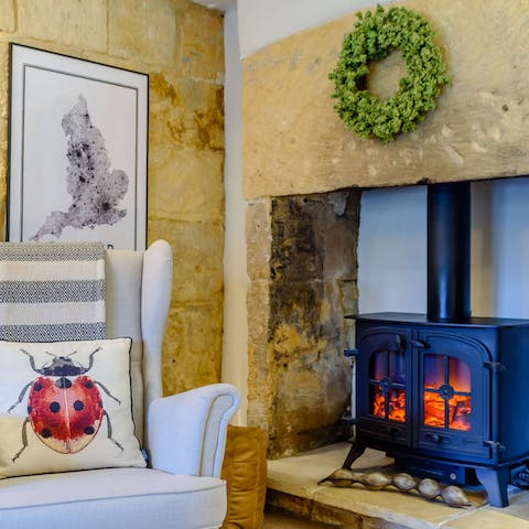 Get warm next to the stone inglenook fireplace after a long walk 