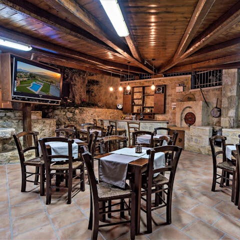 Host a celebration in the taverna-style dining area outside