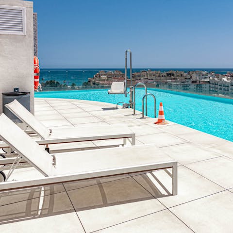 Soak up sea views from the shared rooftop pool