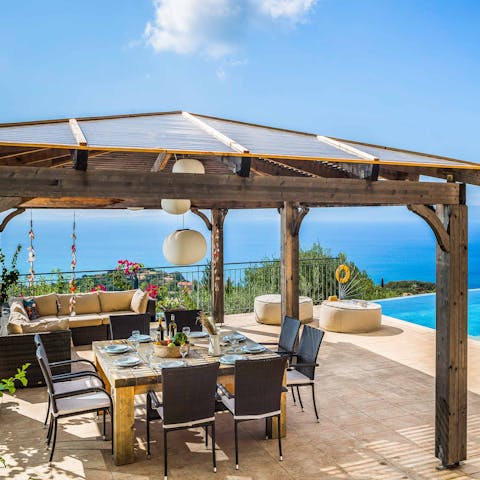 Dine alfresco on the covered terrace for views of Mounda beach and Katelios Bay