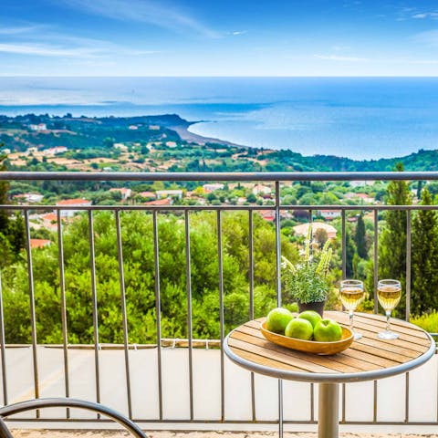 Savour drinks on the terrace and views of the island of Zakynthos