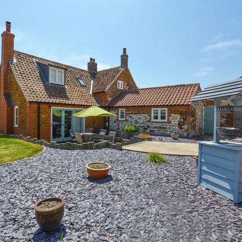 Soak up the sunshine while dining on the home's private terrace