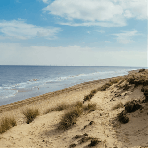 Explore the windswept beauty of the Norfolk coastline, reached in under ten minutes' drive