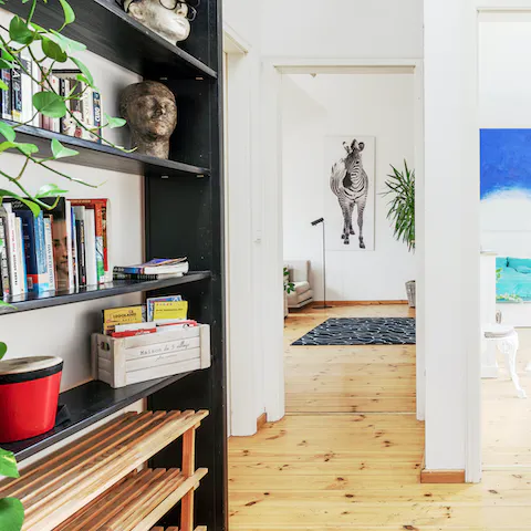 Admire the odds and ends, quirky wall art and abundant house plants that make for a homey feeling