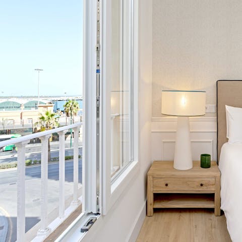 Take in the sea glimpses from the main bedroom's Juliet balcony