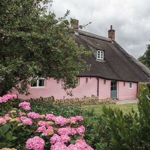 Enjoy a stay in a traditional thatch-roof cottage