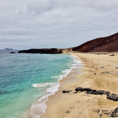 Spend the day on Playa del Papagayo, a series of stunning beaches, a twenty-four-minute drive from this home