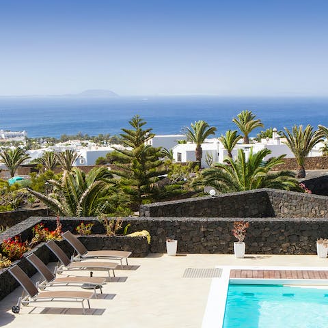 Admire the vistas of the Atlantic Ocean over to the island of Fuerteventura from the balcony