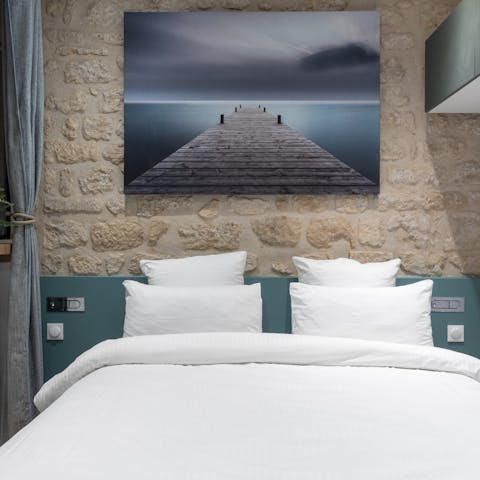 Get a good night's sleep in the sumptuous bed after a busy day roaming Paris