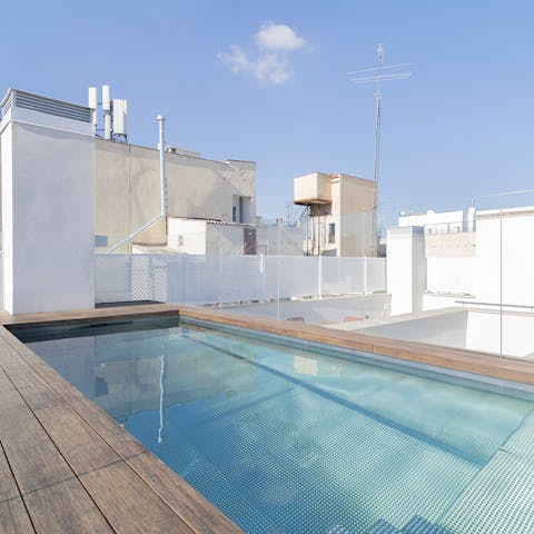 Enjoy a dip in the communal rooftop pool when the temperature rises