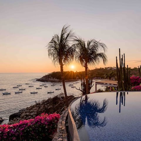 Catch those magical sunsets from the infinity pool, glass of champagne in hand 