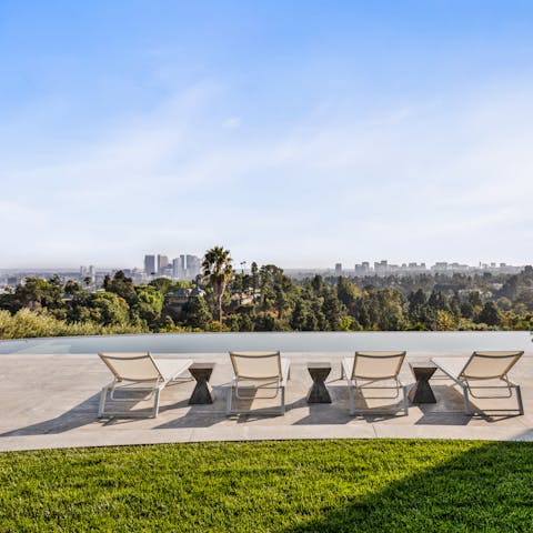 Admire the stunning views of the Los Angeles skyline from the infinity pool