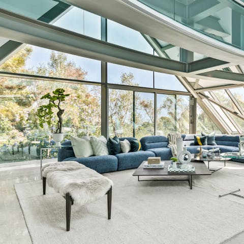 Take in the vistas over the tree canopy from the walls of glass in the living space