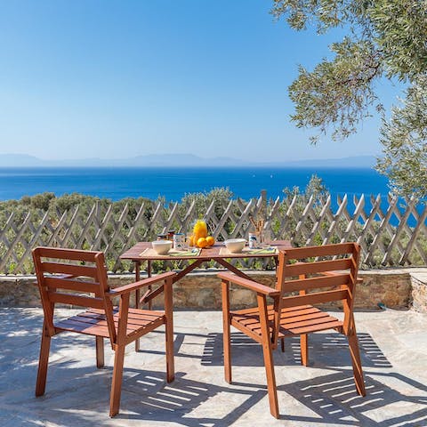 Dig into alfresco meals on the sunny terrace, watching the ocean ebb and flow