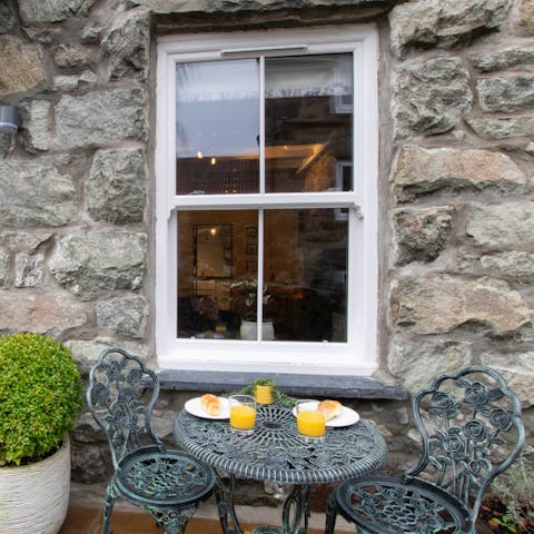 Make the most of sunny spells and enjoy teatime at this ornate outdoor table for two