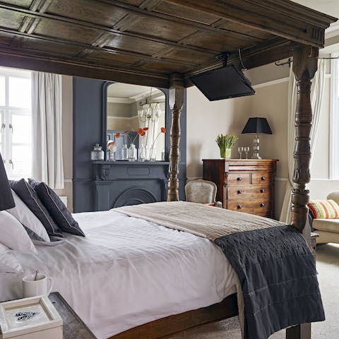Fall in love with the antique four-poster bed