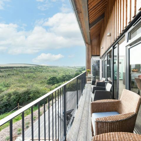 Enjoy the fresh air out on the balcony, with expansive views of the Cornish countryside
