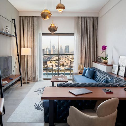 Enjoy glorious views of the city's opulent skyline from the tall windows