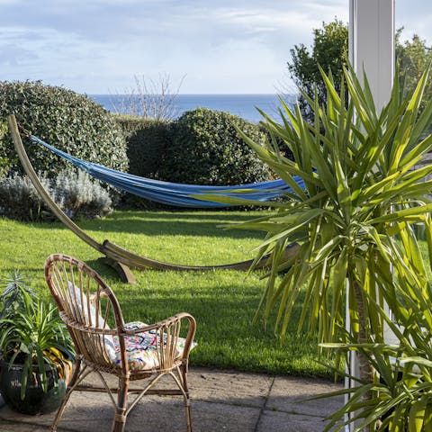 Lose yourself to a good book (or just the horizon) in the garden's hammock