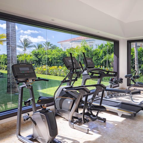 Stay on top of your fitness in your private gym, with stunning views before you