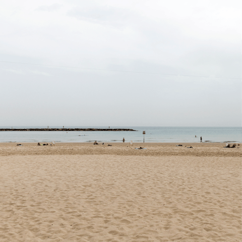 Feel the sand beneath your feet at nearby Frishman beach, just eight minutes on foot from your apartment