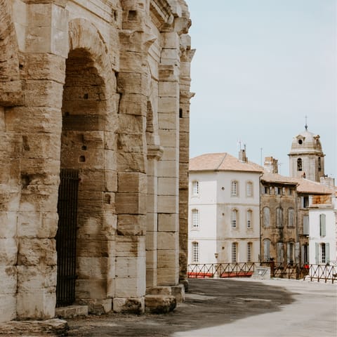 Visit the Roman-influenced city of Arles, just a twenty-five minute drive