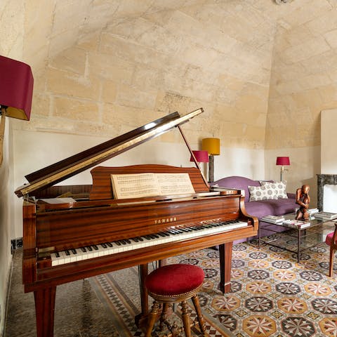 Tickle the ivories of the grand piano in one of the three living rooms