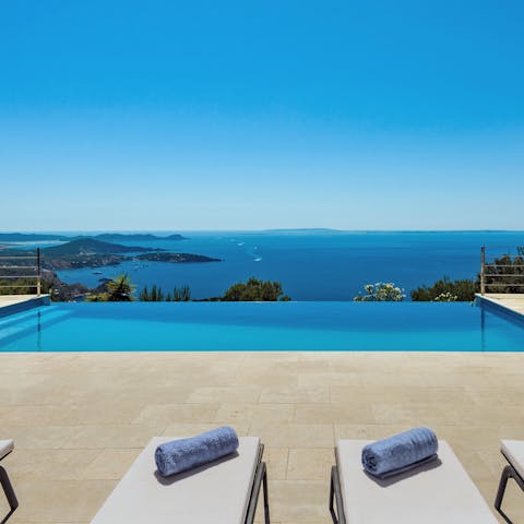 Take a dip in the cool waters of the private infinity pool, and look out at the stunning Es Cubells bay