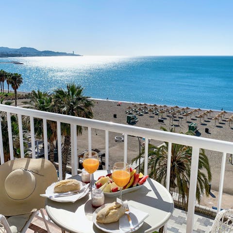 Take in the views over Playa de la Malagueta from the balcony