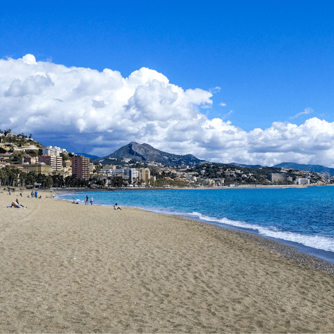 Go for a dip in the Mediterranean Sea at Playa de la Malagueta, 20 metres away