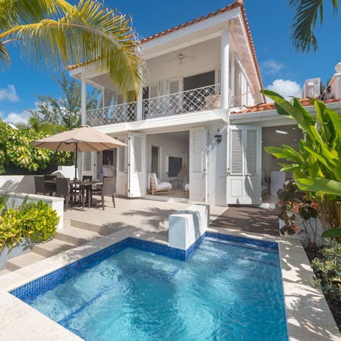 Enjoy an uplifting swim while gazing at palm trees from your private plunge pool