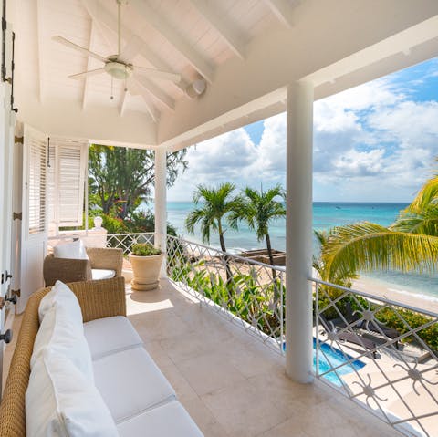 Soak in the views of the Caribbean sea from your balcony, complete with seating
