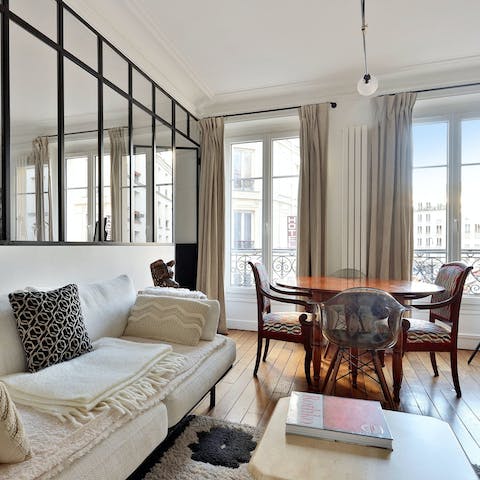 Enjoy views of Parisian rooftops from this bright and welcoming apartment