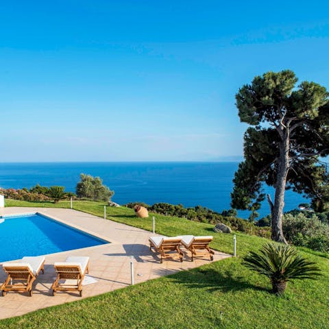 Relax on the sun loungers before unforgettable views of the Aegean sea as far as the eye can see