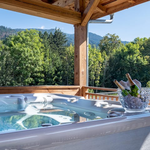 Warm up in the terrace's Jacuzzi and admire the mountain views
