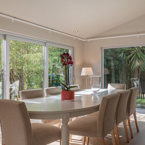 Throw open the huge glass doors and tuck into dinner with a cool breeze circulating around the house