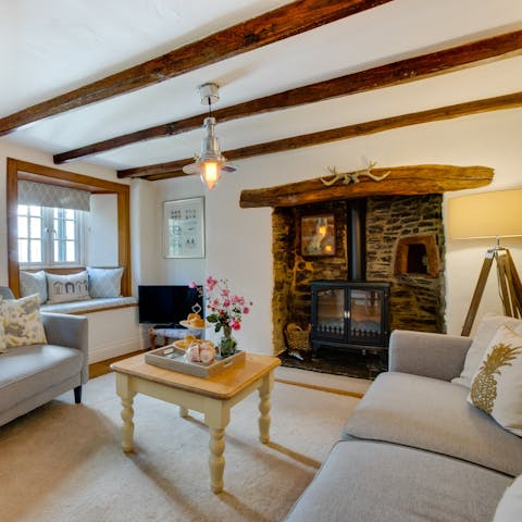 Curl up by the living room's fire with a good book on cooler nights