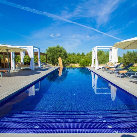 Cool off with a refreshing dip in the crystalline waters of the outdoor pool