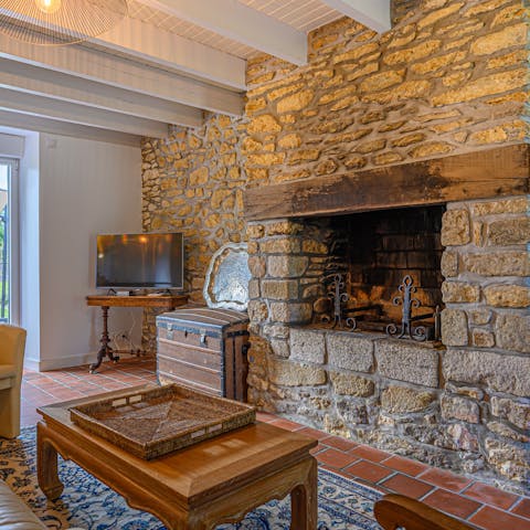 Cosy up in front of the stone fireplace, perfect for chilly mornings with your family