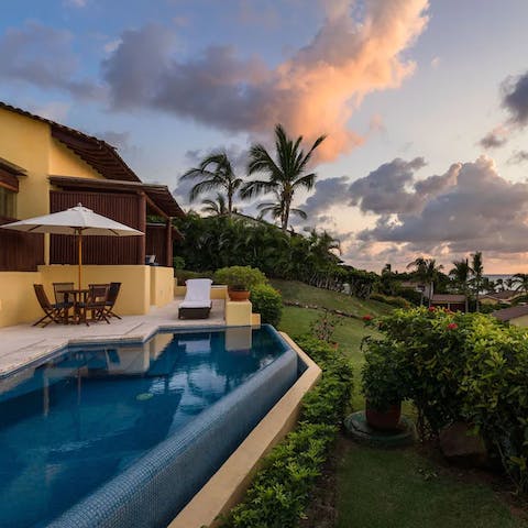Enjoy a few leisurely laps of your heated infinity pool at sunset