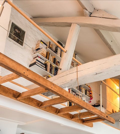 Admire the original stone and wood features of the mezzanine