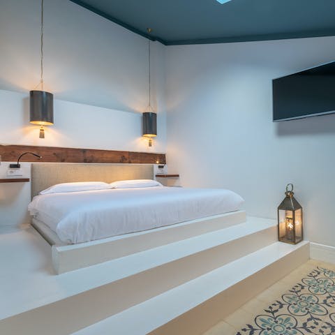 Enjoy a restful night's sleep in the serene bedroom space