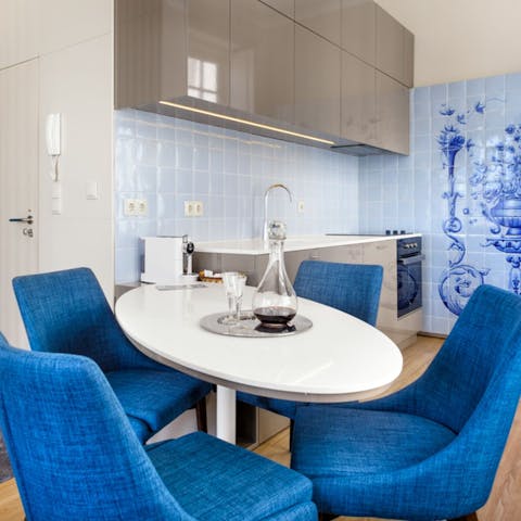 Admire the water-inspired interior design as you dine beside decorative wall tiles