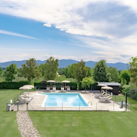 Relax by the shared pool with views of the Umbrian countryside